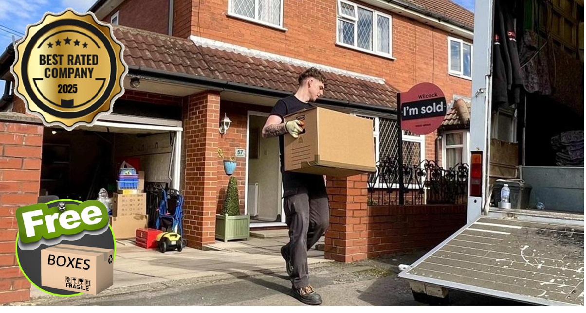 A Bellwoods team member carrying a box on delivery day, returning stored furniture to a customer's home