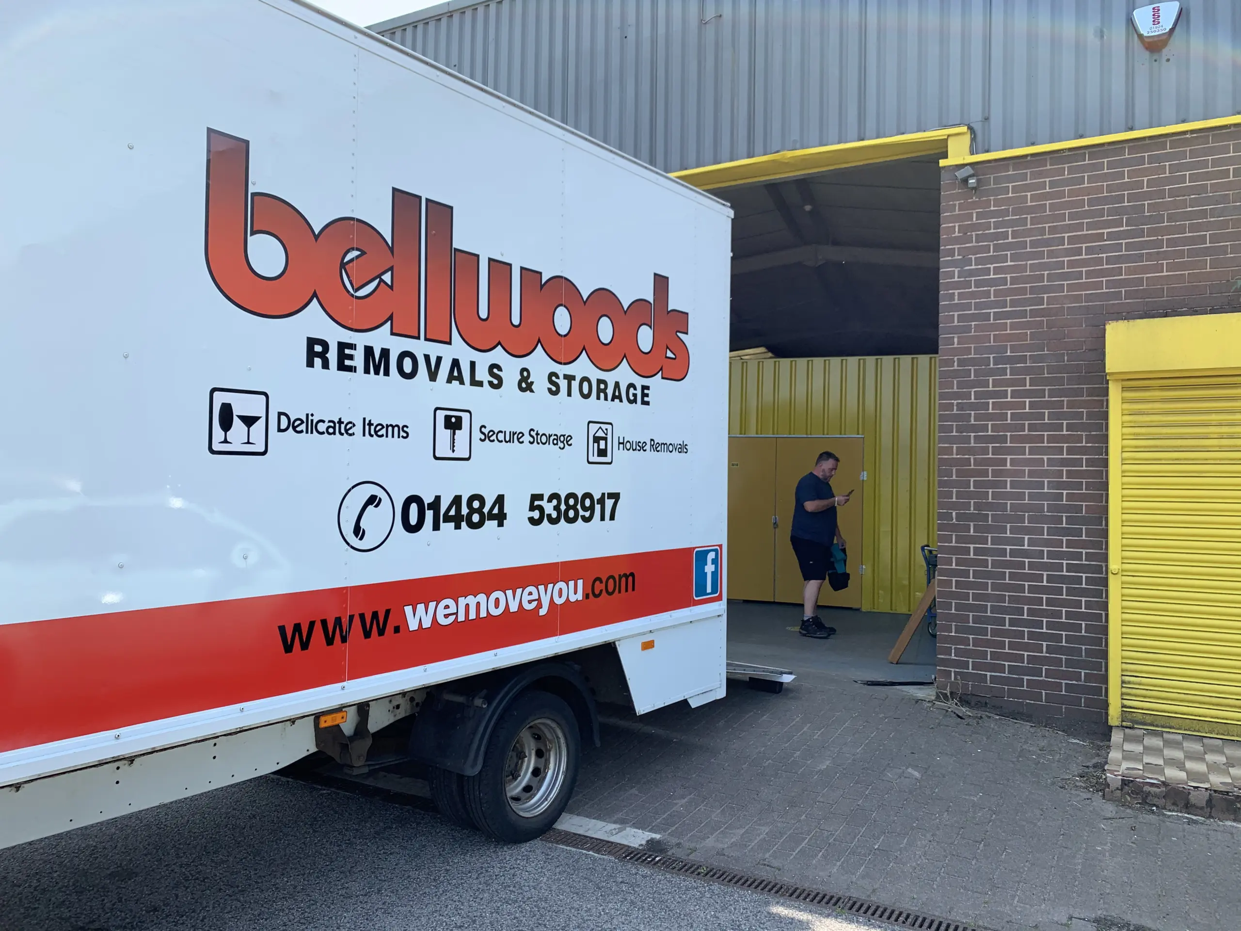 Inside Bellwoods' secure indoor furniture storage warehouse in Huddersfield, with furniture and boxes neatly stacked
